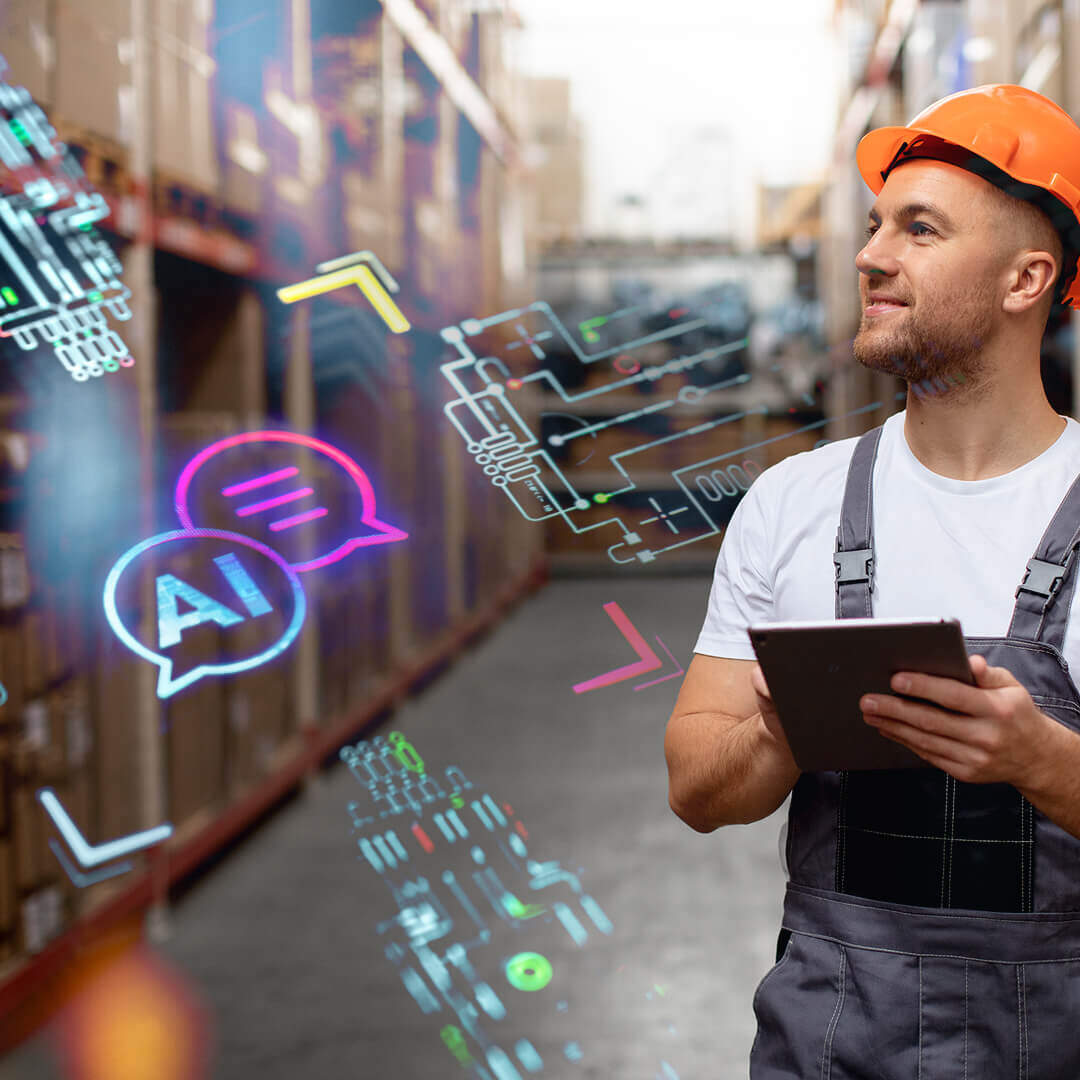 a man in a safety helmet and work overalls, standing in a warehouse environment. He is holding a tablet and looking up, possibly interacting with or analyzing data. The scene is digitally enhanced with glowing AI-related symbols, such as chat bubbles and circuits, suggesting the integration of artificial intelligence in the workplace. The background shows shelves filled with boxes, indicating a logistics or inventory setting | AI Agency SUNZINET