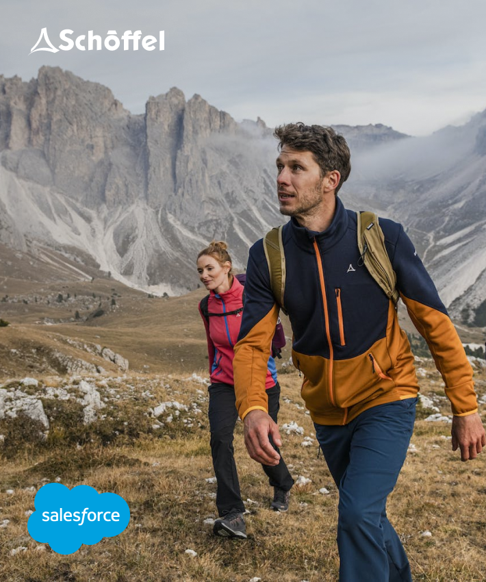 Referenz-Bild einer sportlichen Frau und einem Mann mit Wanderkleidung von Schöffel am Wandern in den Bergen mit Schöffel Logo und Salesforce Logo 