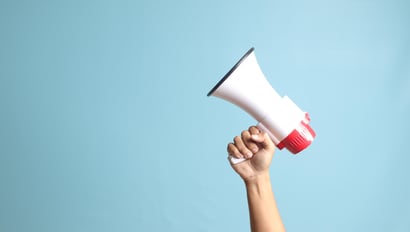 Hand with megaphone as a symbolic image for a successful B2B campaign